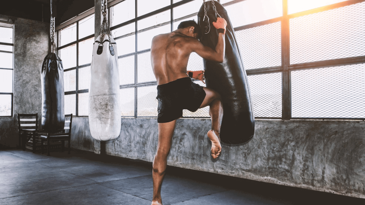 Strong Asian Boxing Woman Jump Kick To Huge Punching Bag At Fitness Gym.  Athletic Girl Training Muay Thai Boxing For Bodybuilding And Healthy  Lifestyle Concept. Workout In Sport Club. Stock Photo, Picture