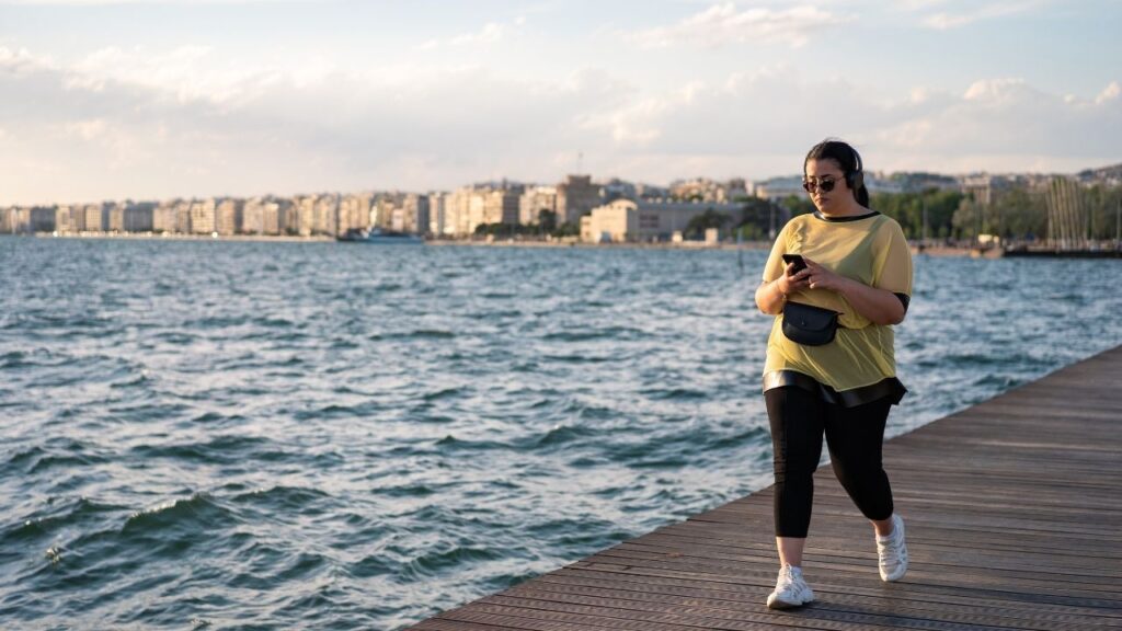 overweight-girl-walking-beach